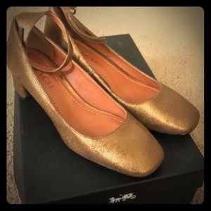 Coach gold pumps size 7. Never worn